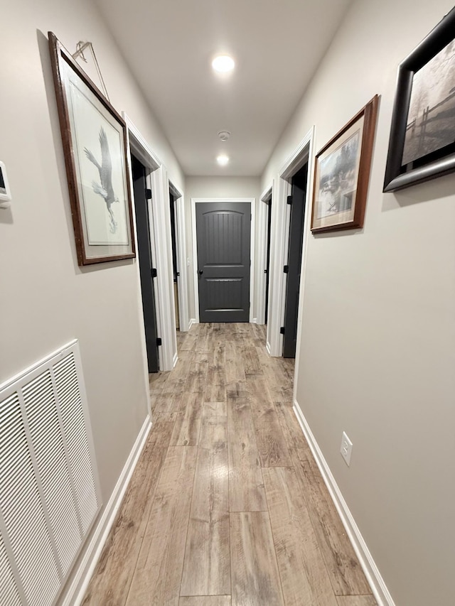 hall with light wood-type flooring