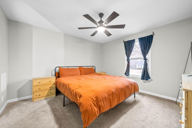 bedroom featuring ceiling fan and carpet