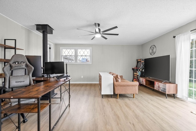 office area featuring ceiling fan, a textured ceiling, and light wood-type flooring