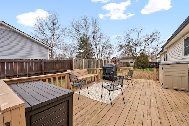 wooden deck featuring grilling area