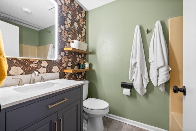 bathroom with vanity, a shower, and toilet