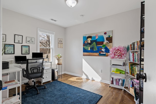 office with hardwood / wood-style flooring