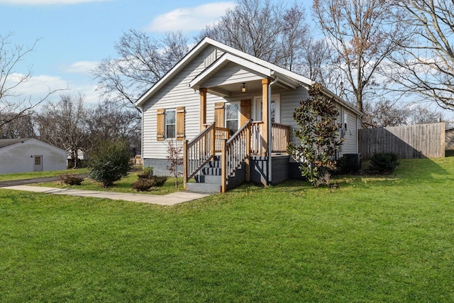 bungalow featuring central AC and a front lawn