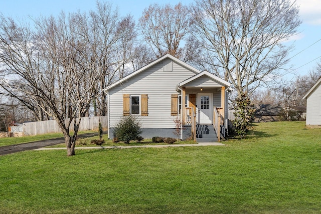 bungalow-style house with a front yard