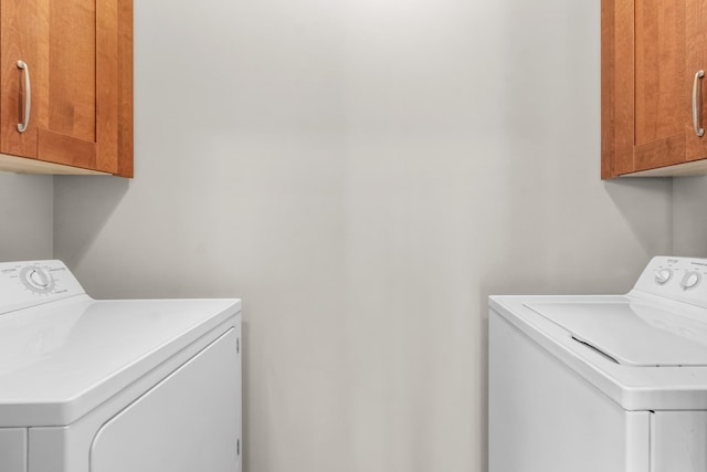 laundry room featuring cabinet space and independent washer and dryer