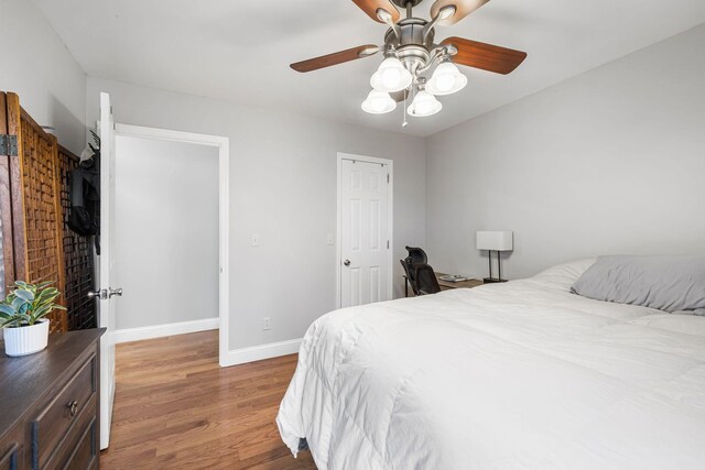 bedroom featuring wood-type flooring and ceiling fan