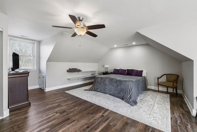 bedroom with dark wood-type flooring, ceiling fan, and vaulted ceiling