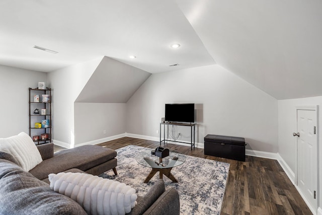 living room featuring dark wood-type flooring and lofted ceiling