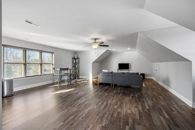 home office with ceiling fan, dark hardwood / wood-style flooring, and vaulted ceiling