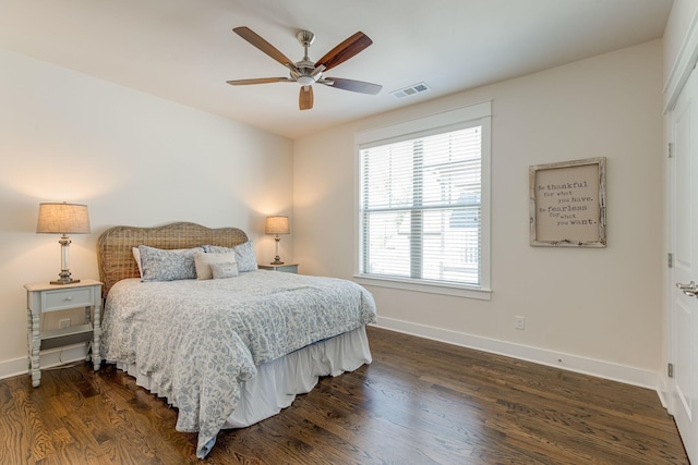 bedroom with dark wood-type flooring and ceiling fan