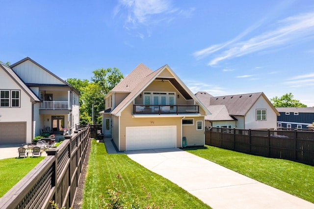 view of front facade featuring a garage, a front yard, and a balcony