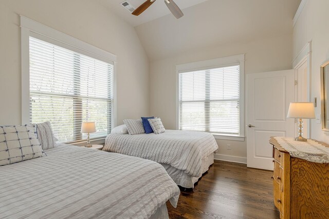 bedroom featuring ceiling fan, dark hardwood / wood-style flooring, and vaulted ceiling