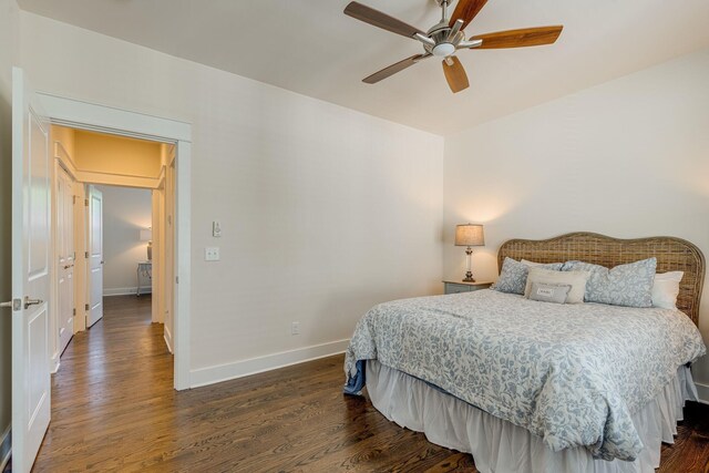 bedroom featuring ceiling fan and dark hardwood / wood-style flooring