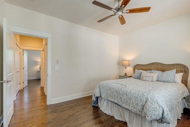 bedroom featuring ceiling fan and dark hardwood / wood-style flooring