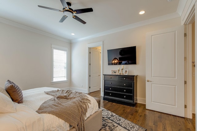 bedroom with crown molding, ceiling fan, and dark hardwood / wood-style flooring