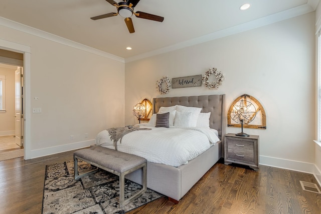 bedroom featuring crown molding, dark wood-type flooring, and ceiling fan