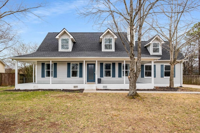 cape cod house with a front lawn and covered porch