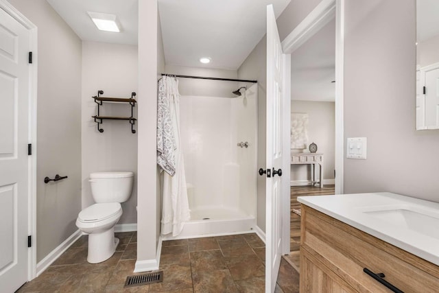 bathroom with vanity, a shower with curtain, and toilet