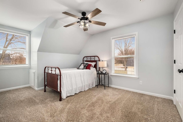 bedroom with vaulted ceiling, carpet flooring, and ceiling fan