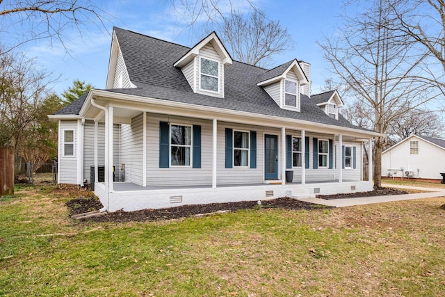 cape cod home featuring covered porch and a front lawn