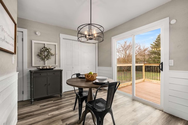 dining room with a chandelier and dark hardwood / wood-style flooring