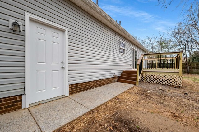 property entrance with a deck