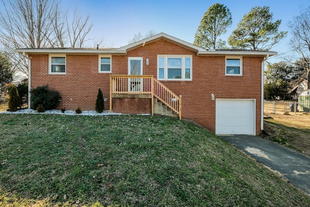 view of front of home with a garage and a front yard