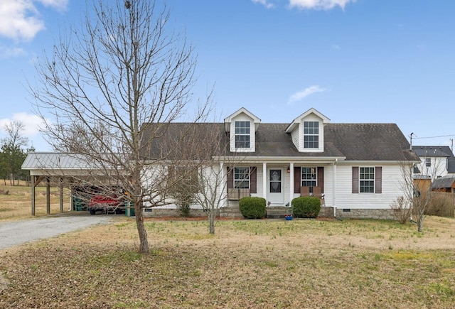 cape cod home featuring a carport, a porch, and a front yard