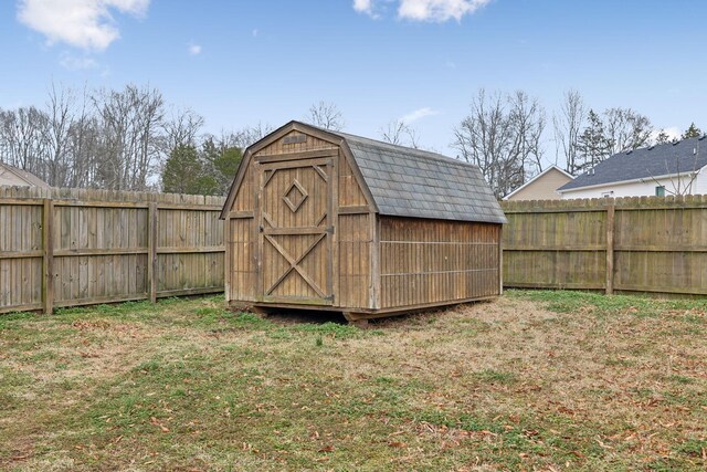 view of outbuilding featuring a yard