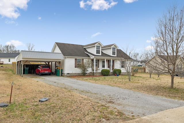 cape cod house with a carport and a front lawn