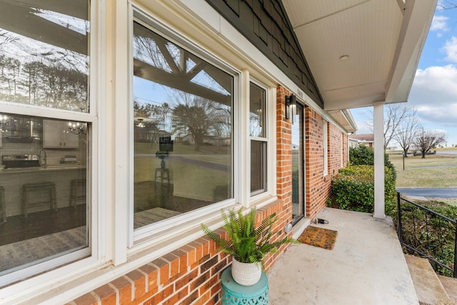 view of patio featuring a porch and sink