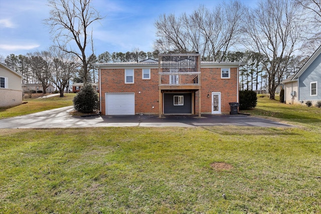 back of property featuring a yard and a garage