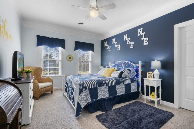 carpeted bedroom with crown molding and ceiling fan