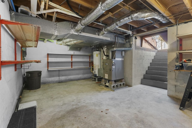 basement featuring heating unit and water heater