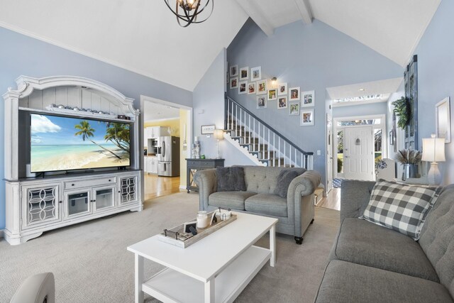 living room with high vaulted ceiling, a chandelier, beamed ceiling, and carpet flooring