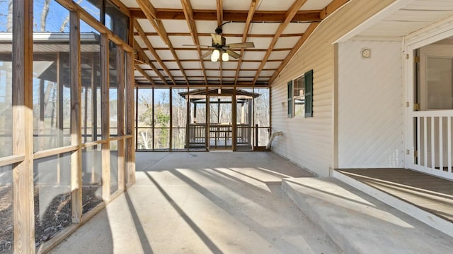 unfurnished sunroom with lofted ceiling and ceiling fan