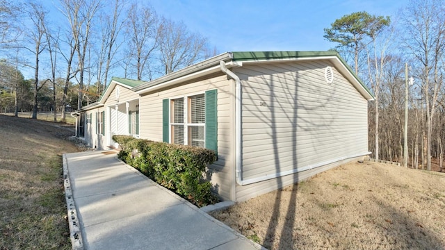 view of home's exterior featuring a yard