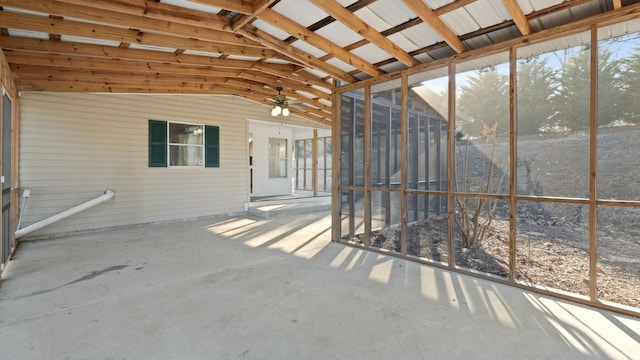 unfurnished sunroom featuring lofted ceiling