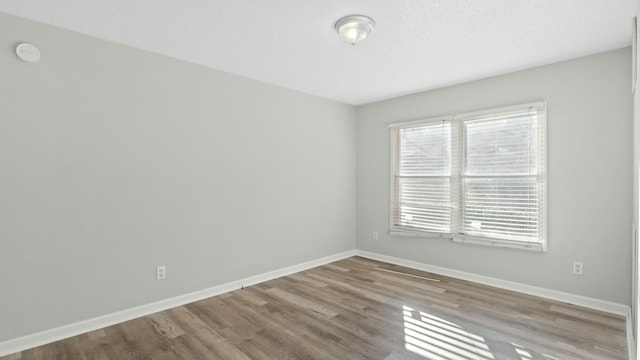 unfurnished room featuring light wood-type flooring