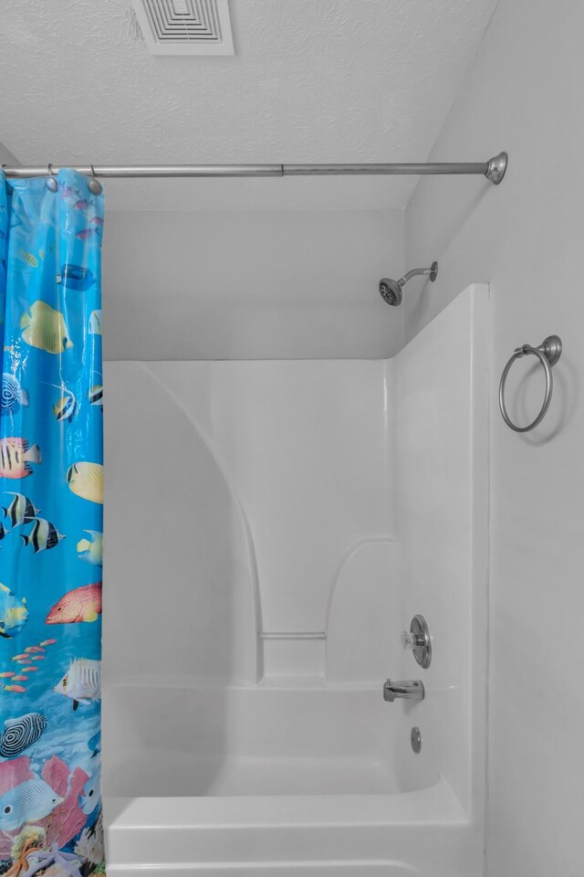 bathroom featuring a textured ceiling