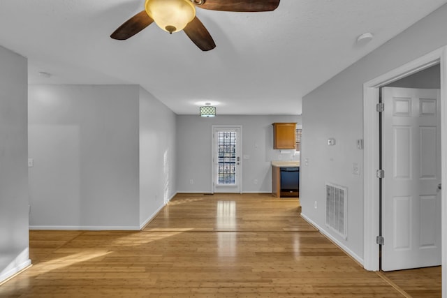 unfurnished living room with light hardwood / wood-style floors and ceiling fan