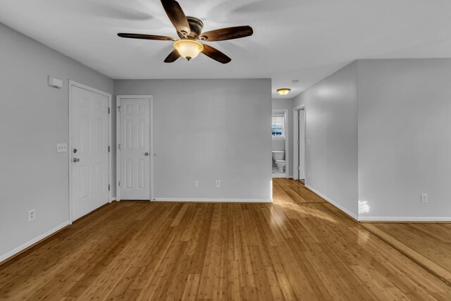 unfurnished room featuring hardwood / wood-style floors and ceiling fan