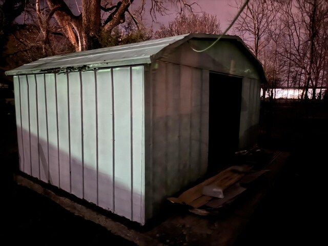 view of outdoor structure at dusk