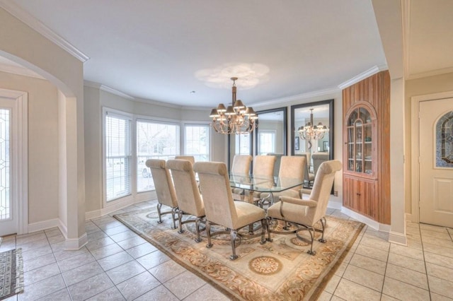 tiled dining room featuring an inviting chandelier and ornamental molding