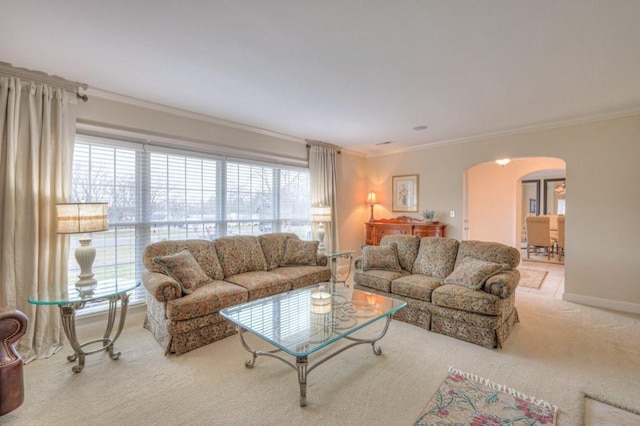 living room featuring crown molding and light carpet