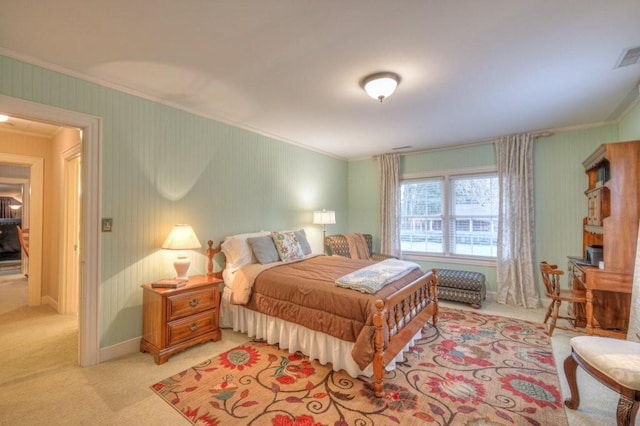 bedroom featuring light carpet and crown molding