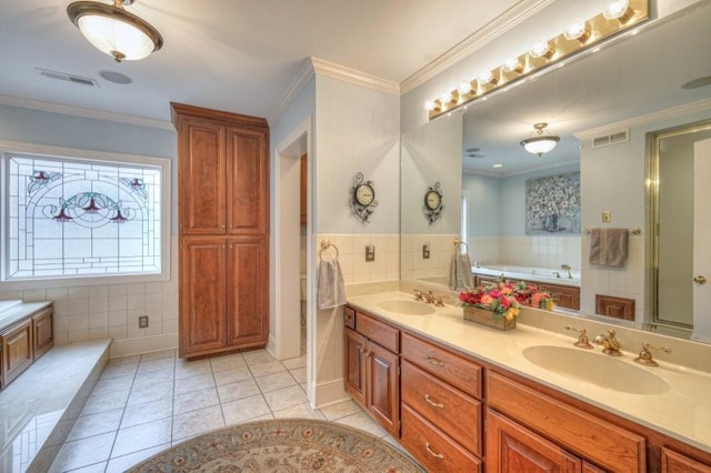 bathroom featuring tile patterned flooring, crown molding, a tub, and tile walls