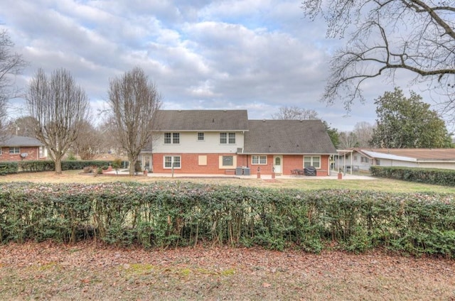 back of property with a patio area