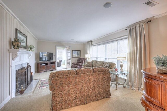 living room with ornamental molding and light colored carpet