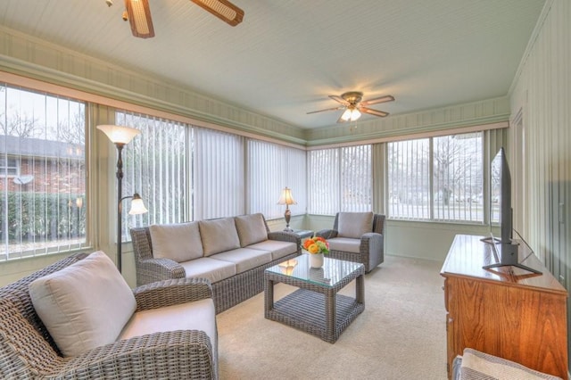 sunroom featuring a healthy amount of sunlight and ceiling fan